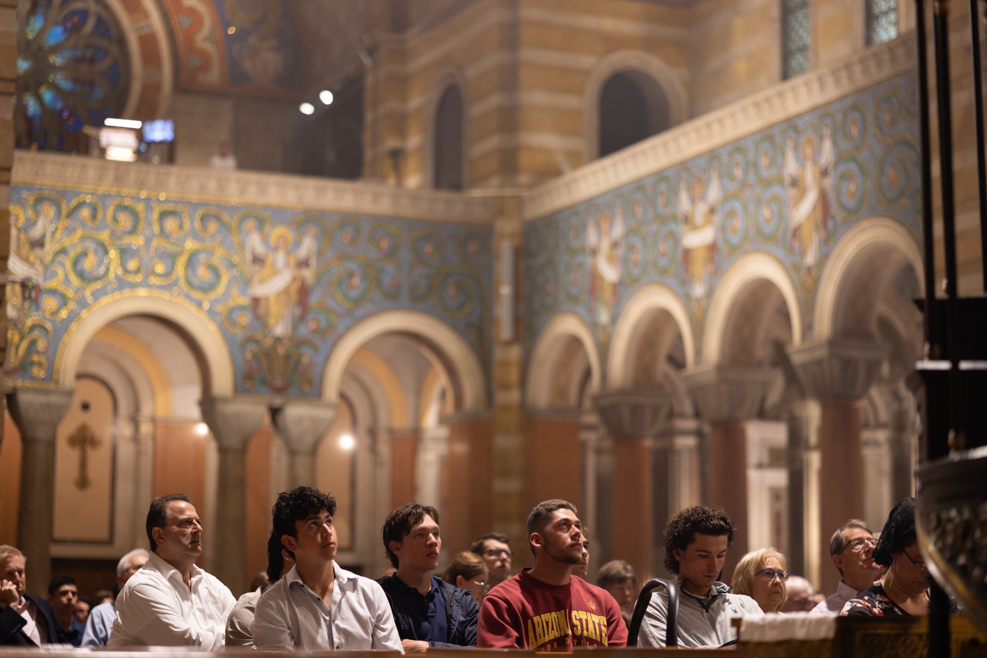 Parishioners gathered in prayer beneath the Cathedral Basilica's mosaics