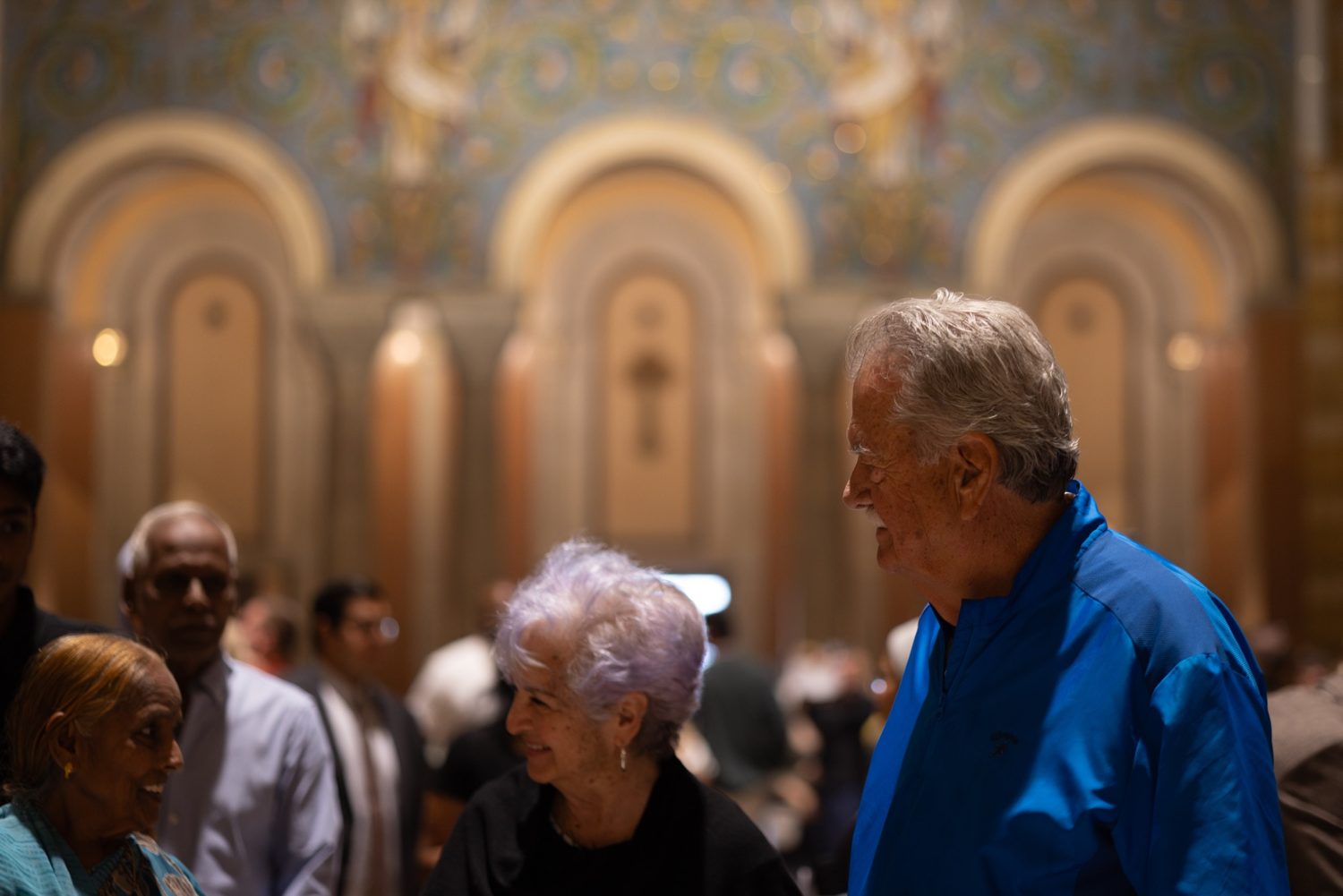 Parishioners greeting one another after Mass